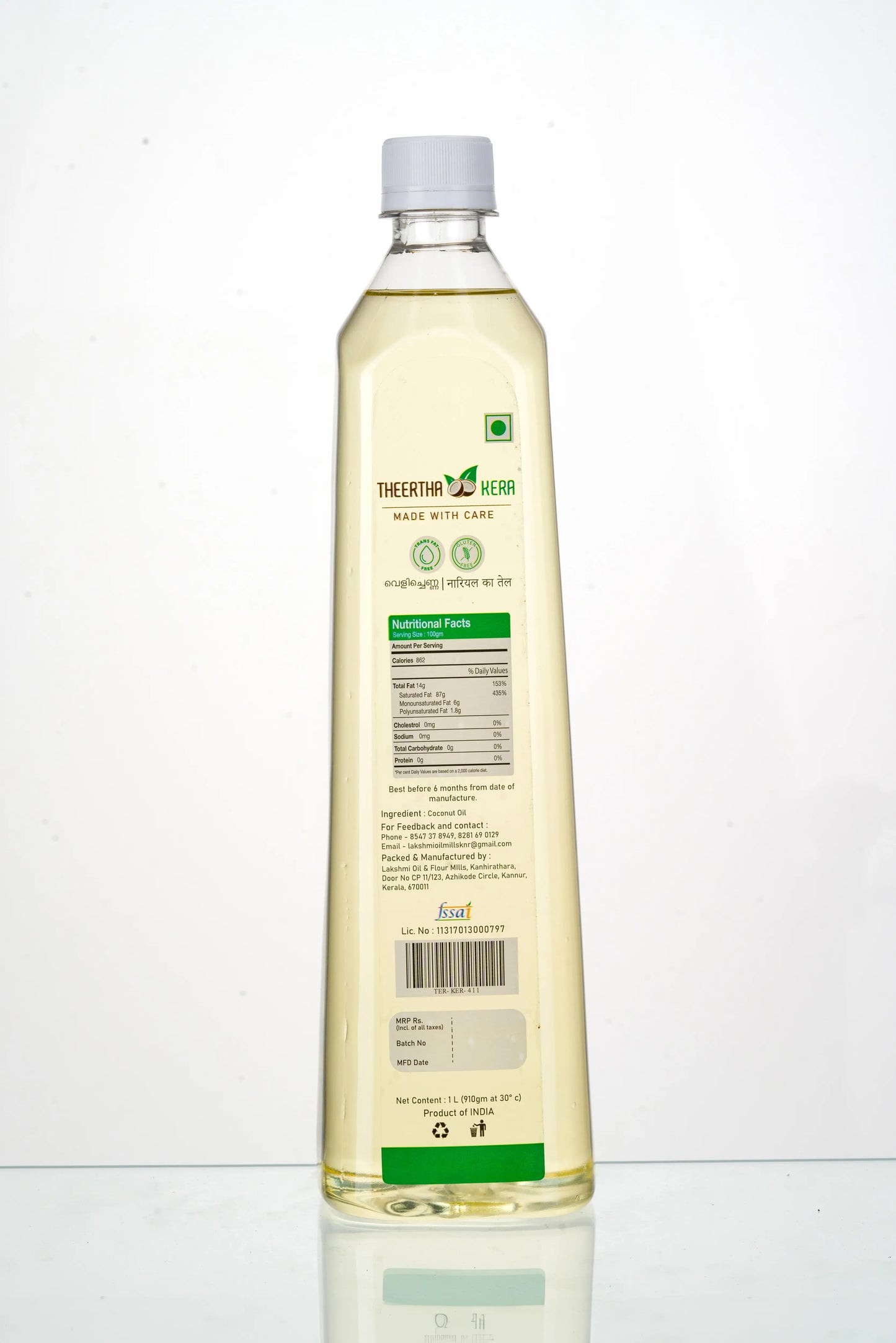 Bottle of cooking oil with a white label on a white background