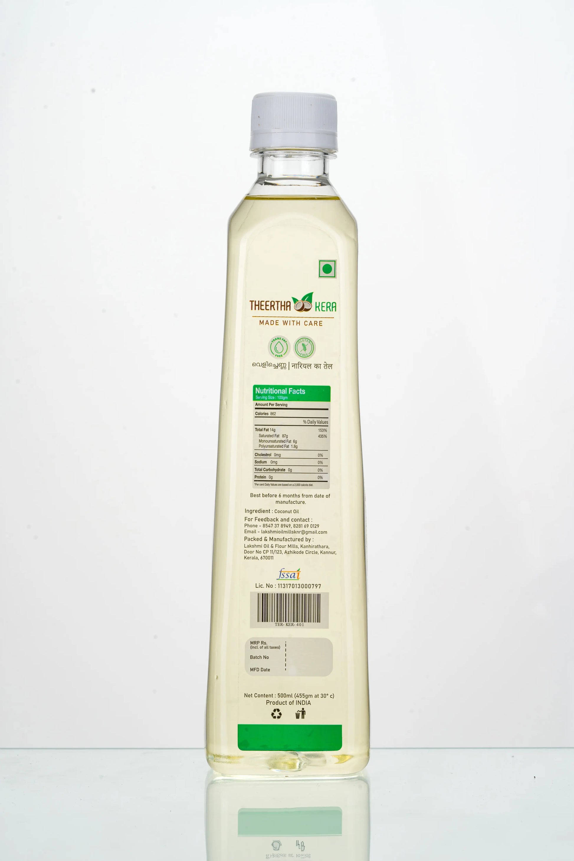 Bottle of Theerthakera coconut oil on a white background