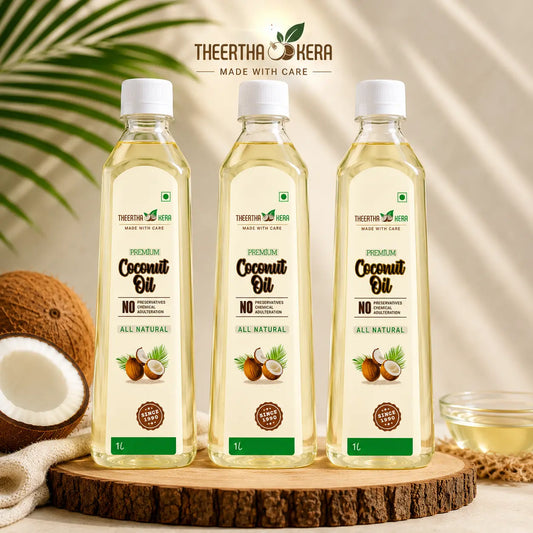 Three bottles of TheertthaKera Premium Coconut Oil arranged on a wooden slice with coconuts, a cloth, and a small bowl in a styled setting. TheertthaKera branding is visible at the top and on the bottle labels.