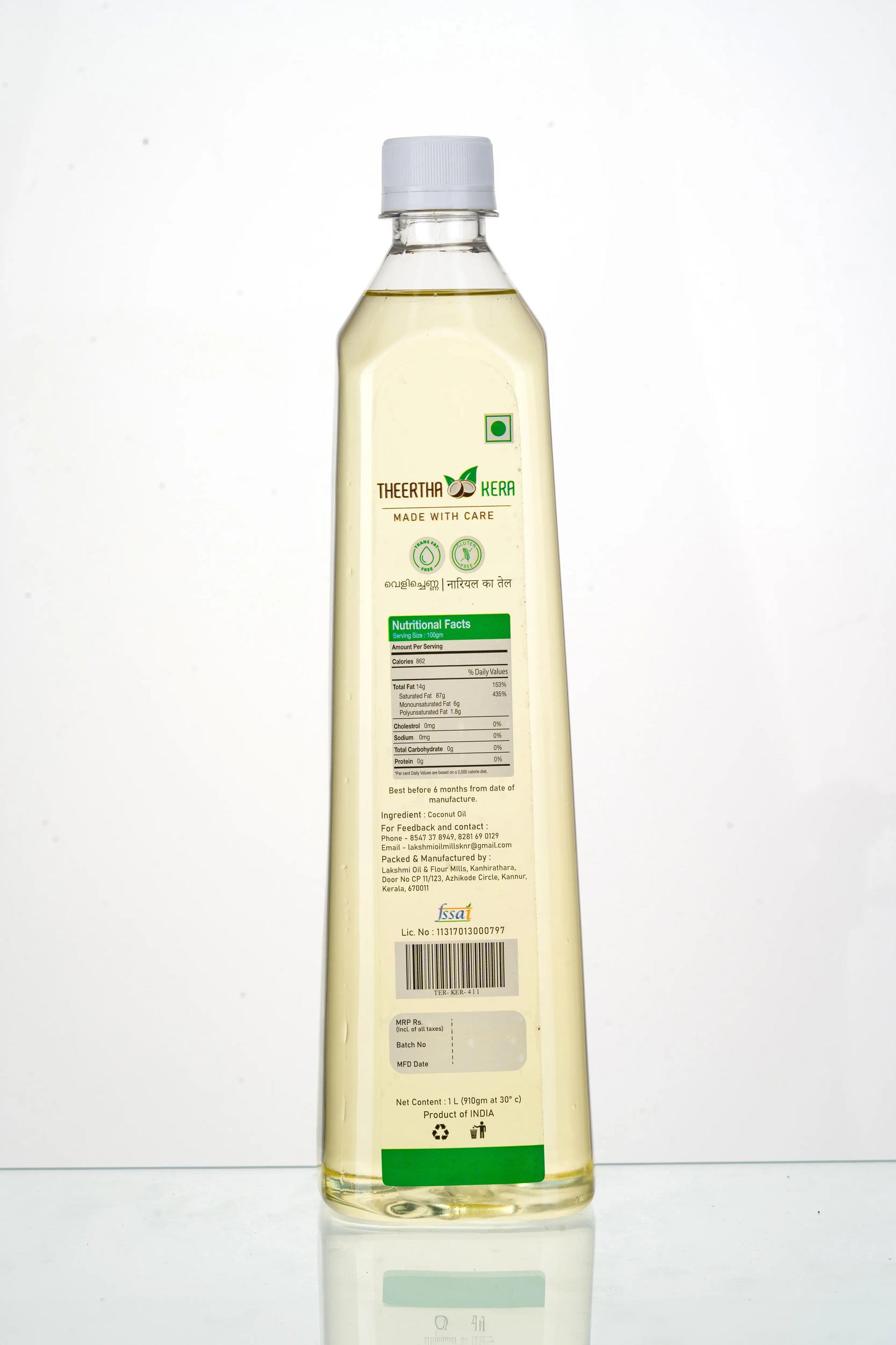 Bottle of cooking oil with a white label on a white background